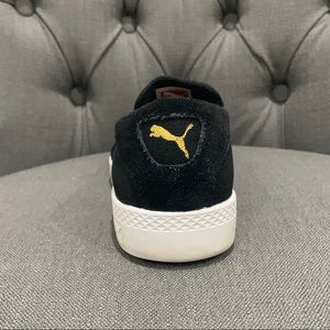Puma black slip on sneakers